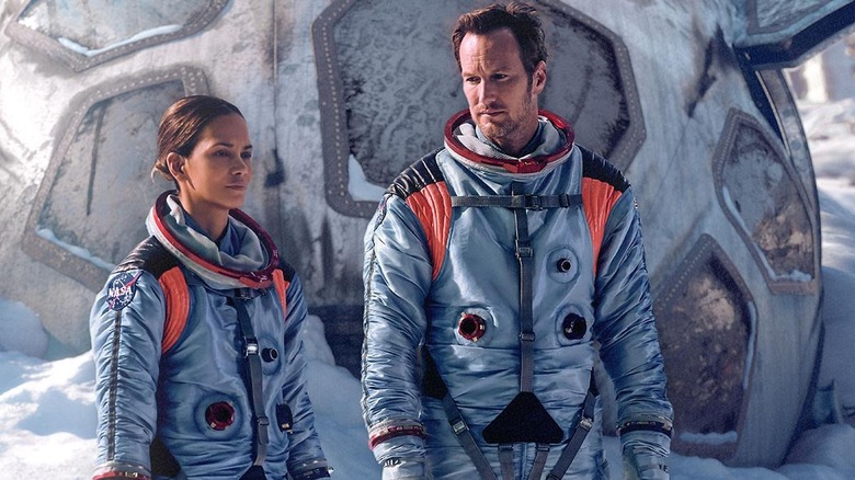 Halle Berry and Patrick Wilson in astronaut suits