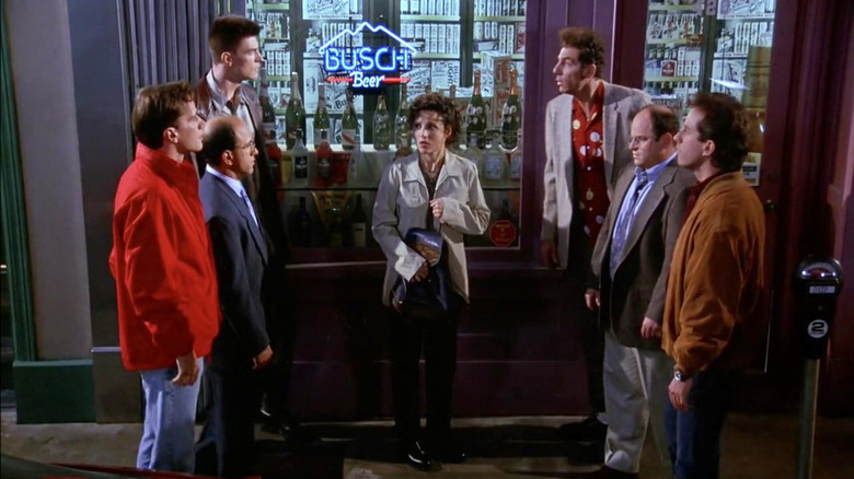 Bizarro Jerry, Kramer, and George opposite the actually Jerry, Kramer, and George, with Elaine in the middle, on Seinfeld