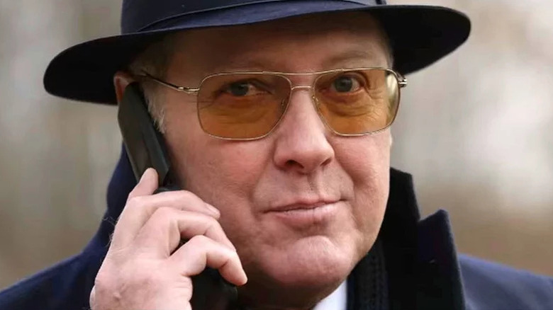 James Spader's Raymond Reddington smirking on the phone on The Blacklist