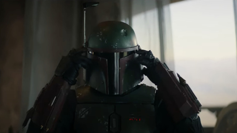 Boba Fett puts on his helmet