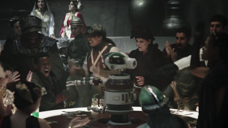 An RX-series droid at a gambling table