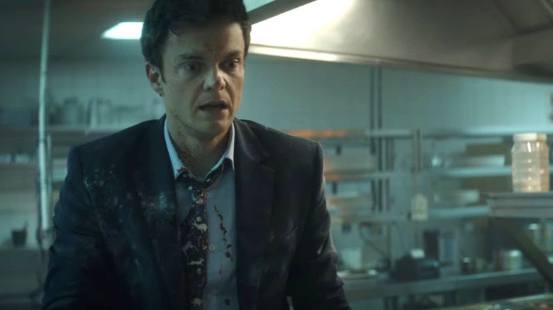 Jack Quaid as Nate during the kitchen fight in Novacaine