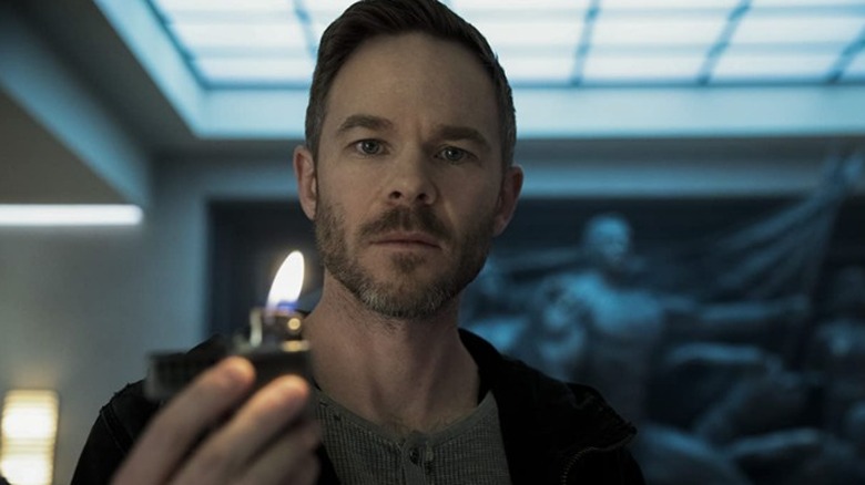 Shawn Ashmore holding lighter