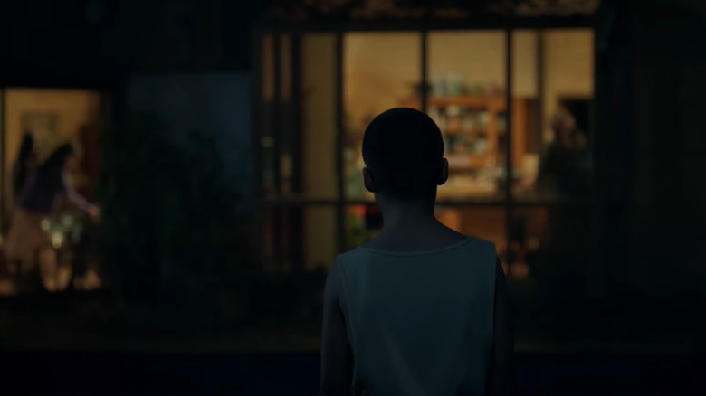 A young boy stands outside a house in Bring Her Back