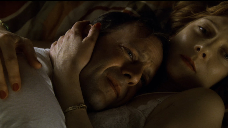 Bruce Willis' Dwayne Hoover lays on Barbara Hershey's Celia Hoover in bed in Breakfast of Champions