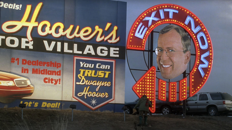 Bruce Willis's Dwayne Hoover is seen on a billboard for his car dealership business in Breakfast of Champions