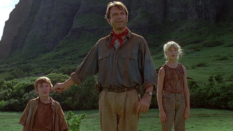 Tim, Dr. Grant, and Lex spot a herd of galloping gallimimus in Jurassic Park