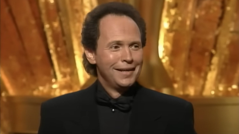 Billy Crystal smiling as the host of the 1993 Oscars ceremony