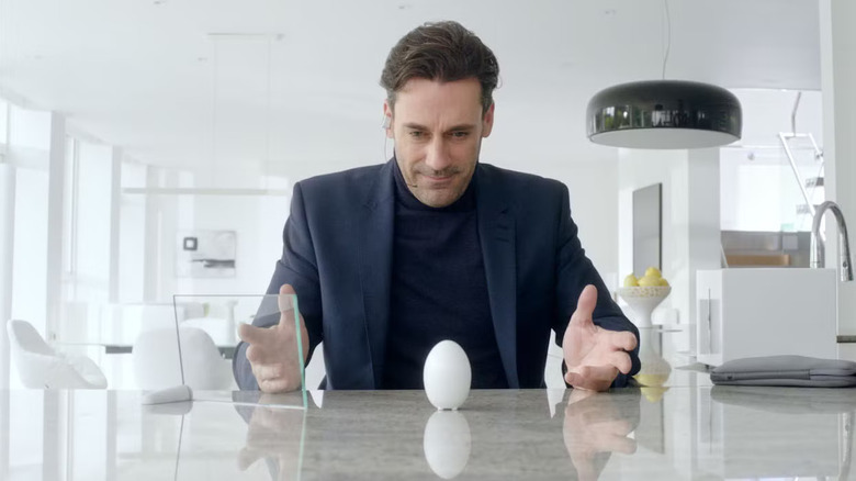 Matt was looking at the egg that was wearing a hedset in the black mirror white Christmas