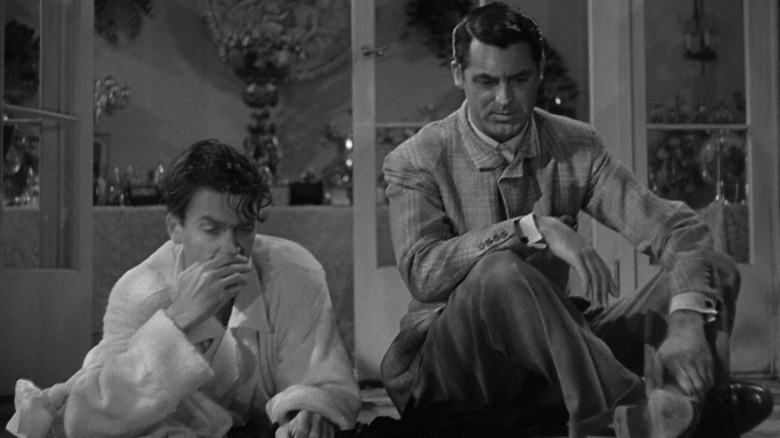 James Stewart's Mike Connor lays smoking next to Cary Grant's C.K. Dexter Haven on the porch of a house in The Philadelphia Story