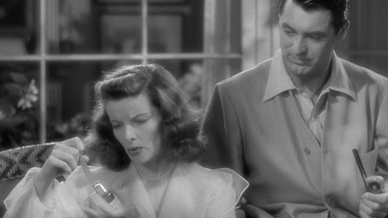 Cary Grant's C.K. Dexter Haven sits next to Katharine Hepburn's Tracy Lord in The Philadelphia Story