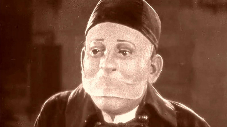 The Phantom wearing a mask in The Phantom of the Opera (1925)