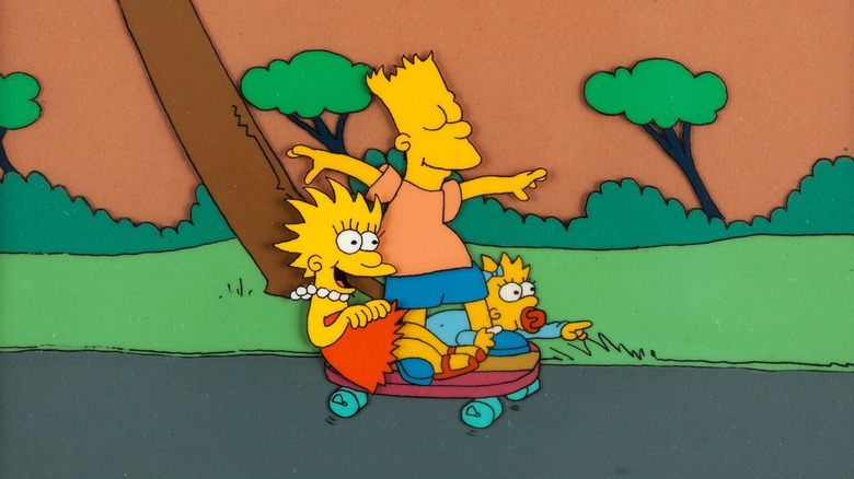 Lisa, Bart and Maggie Simpson driving a skateboard on the Tracy Ulman