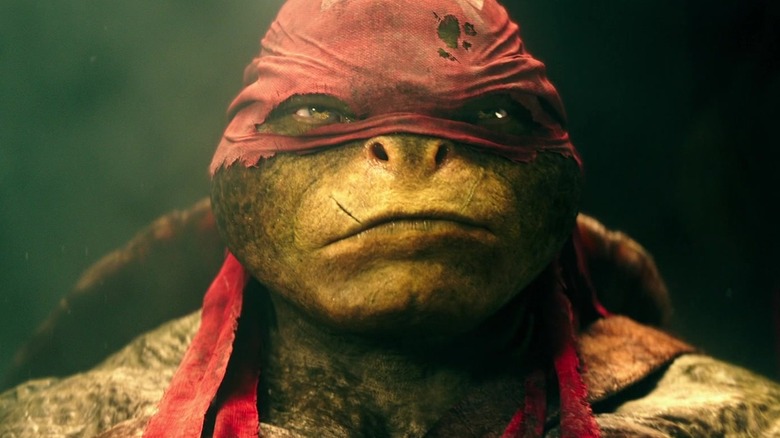 Alan Ritchson as Raphael looking sternly in Teenage Mutant Ninja Turtles (2014)