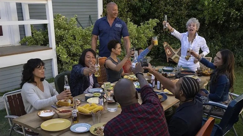 The "Fast" family cheersing with Coronas at the dinner table in "Fast X"