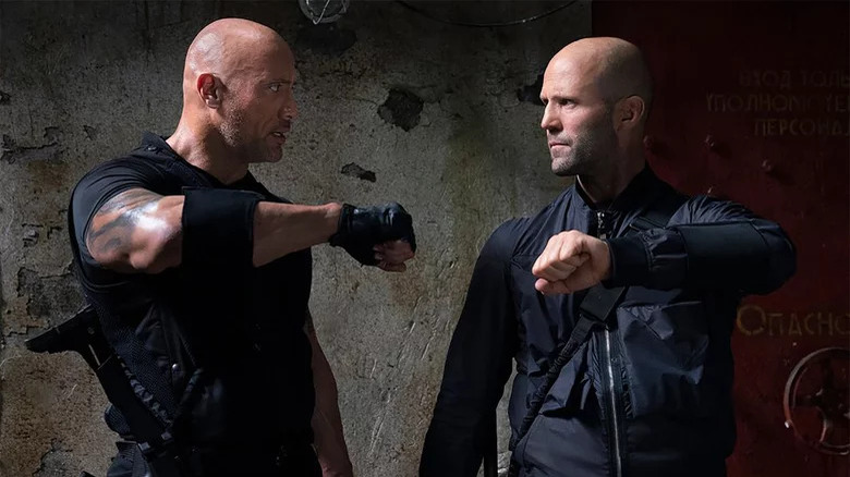 Hobbs and Shaw holding up wrists in Hobbs & Shaw