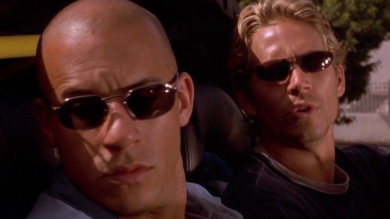 Dom and Brian driving in car with sunglasses in The Fast and The Furious