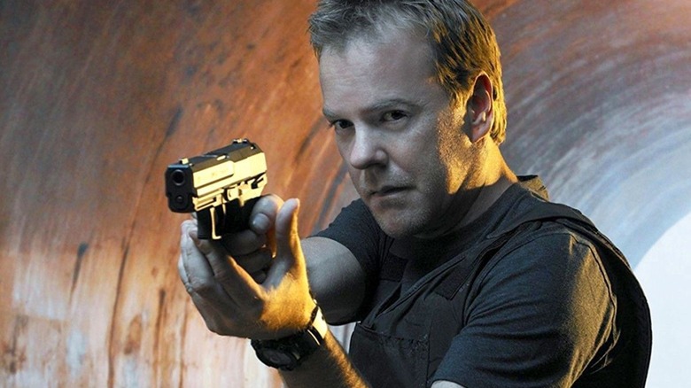 Jack Bauer, holding a gun in a tunnel