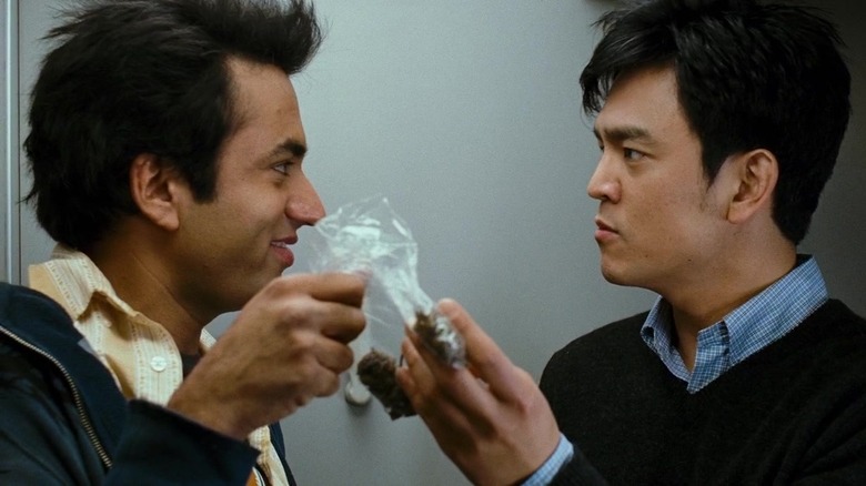 Harold and Kumar holding a bag of weed in Harold & Kumar Go to Guantanamo Bay