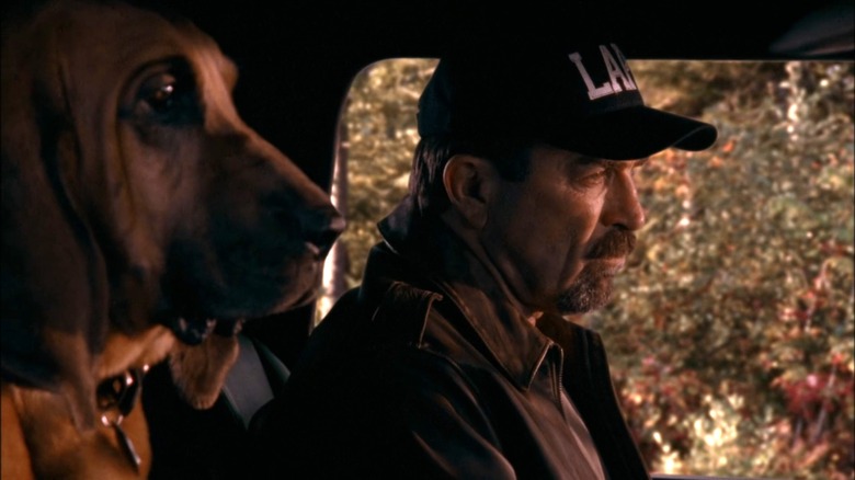 Jesse Stone in truck with dog