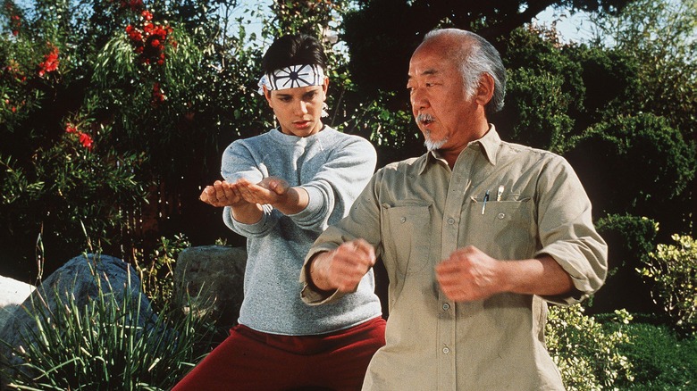 Mr. Miyagi training Daniel LaRusso in The Karate Kid Part II