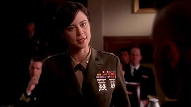 Catherine Bell as Sarah MacKenzie interrogating someone in court in JAG