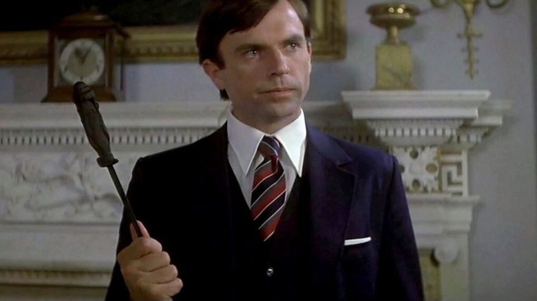 Damien Thorn holding an ancient dagger in The Omen III: The FInal Conflict