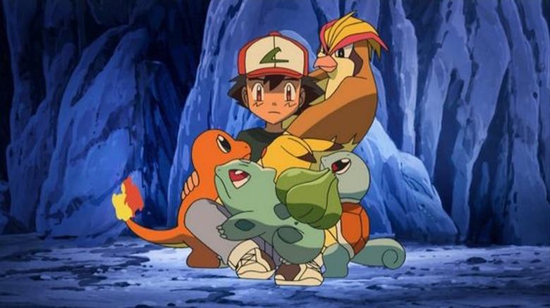 Ash dikelilingi oleh Pokémon -nya saat terjebak di gua di Pokémon Indigo League