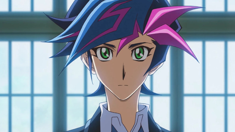 Yusaku Fujiki standing in front of a big window in Yu-Gi-Oh! VRAINS