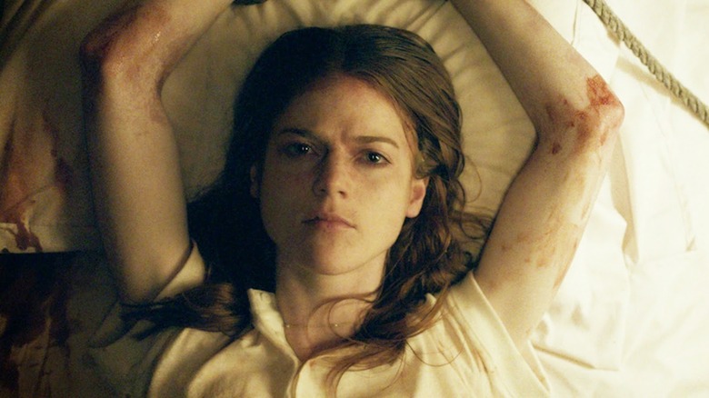 Rose Leslie tied to the bed in Honeymoon