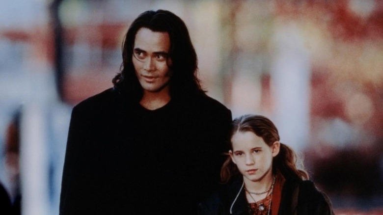 The Crow unmasked and his young charge, Katie