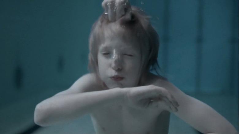 Oskar underwater in Let the Right One In