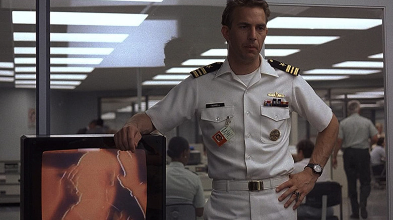 Costner and a developing Polaroid in No Way Out