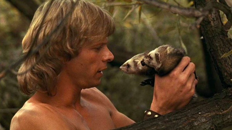 Marc Singer as Dar with his ferrets in The Beastmaster