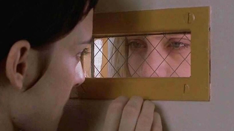 Winona Ryder and Angelina Jolie talking through the door