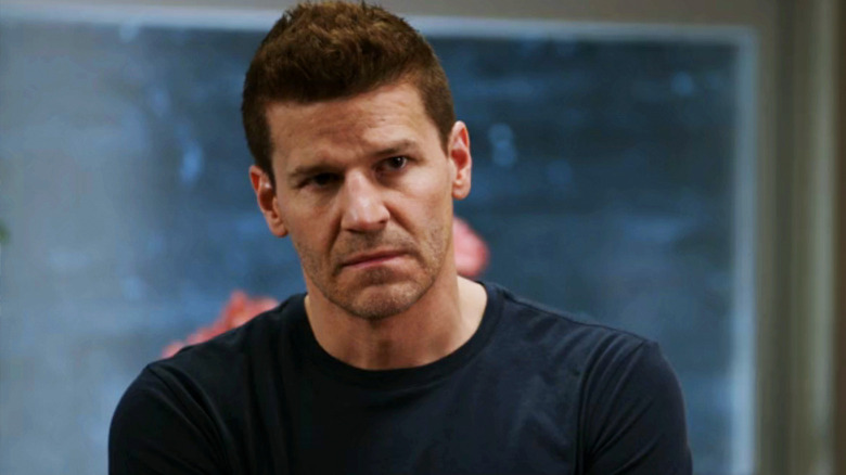 Seeley Booth stands in a hospital waiting room looking concerned