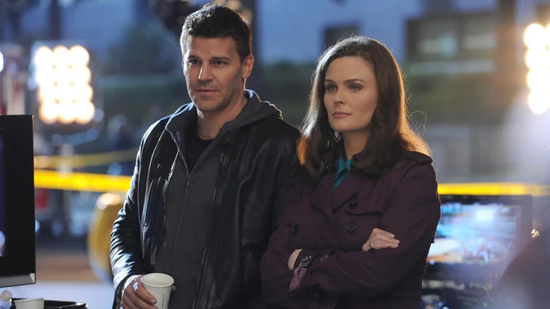 Agent Seeley Booth and Temperance "Bones" Brennan stand at a crime scene in Bones