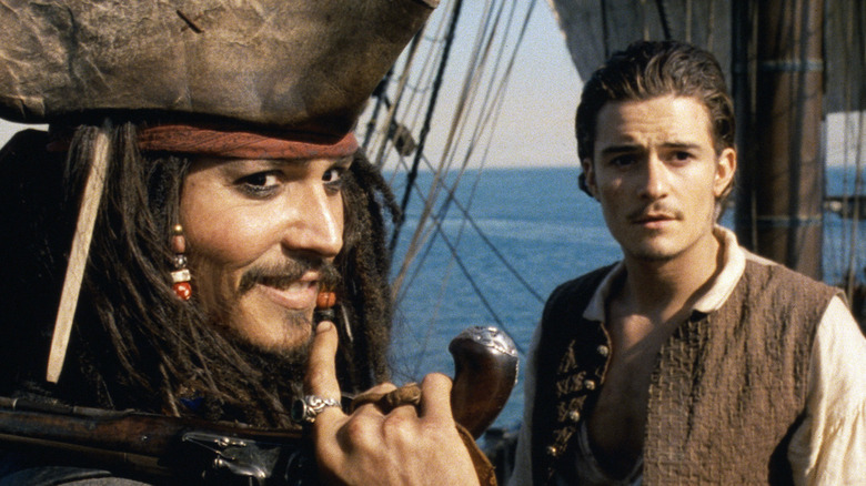 Johnny Depp and Orlando Bloom in Pirates of the Caribbean: The Curse of the Black Pearl