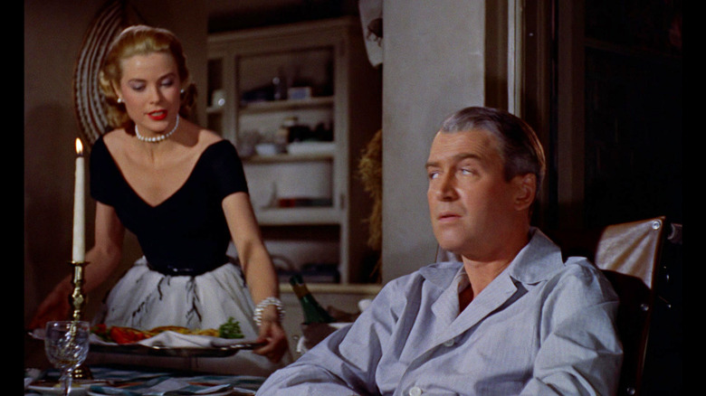 Grace Kelly as Lisa and James Stewart as Jeff sitting down to have a meal in Rear Window