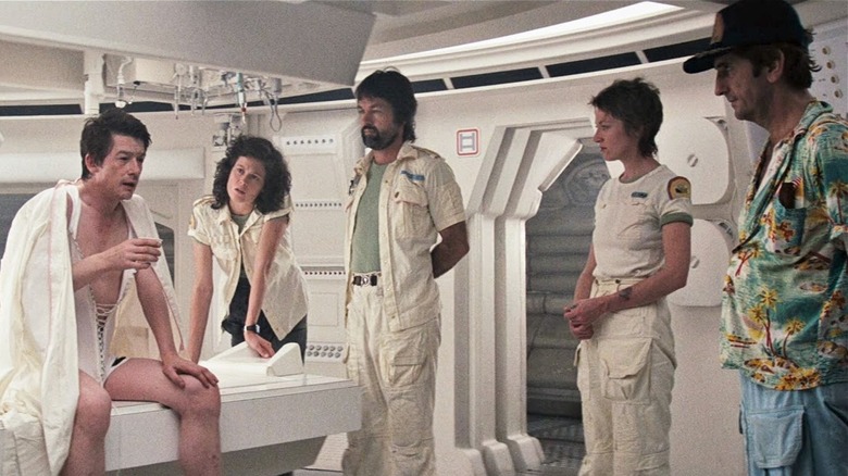 Nostromo crew check on awakened Kane