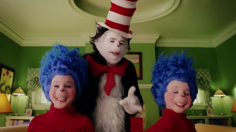 The Cat in the Hat in between Thing 1 and Thing 2, looking ghoulish in the Cat in the Hat movie.