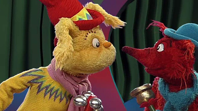 Two animal dolls look at each other in the world of Dr. Seuss.