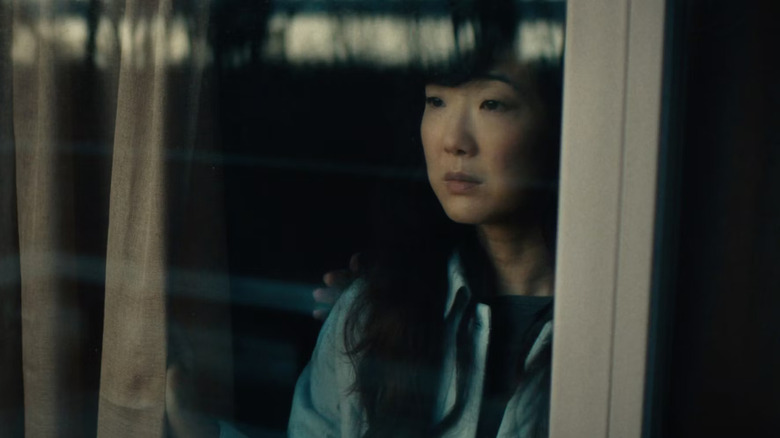 Jennifer Kim looking out window in Somewhere Quiet