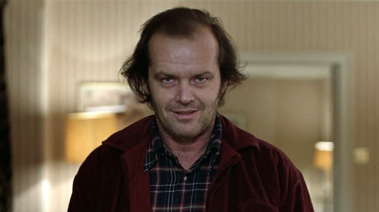 Jack Torrance looking sinister in a bathroom in The Shining