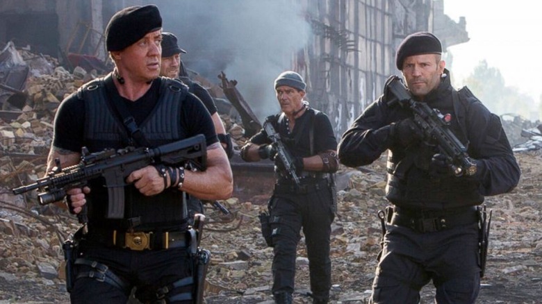 Sylvester Stallone, Randy Couture, Antonio Banderas and Jason Statham walking into battle in The Expendables 3