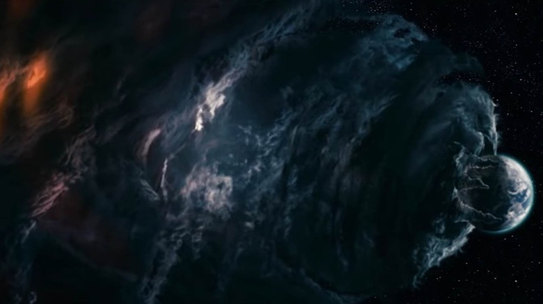 Galaccus cloud trying to eat land in a fantastic four: raising the silver surfer