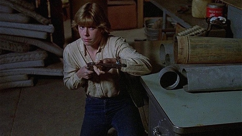 Adrienne King gun kneeling