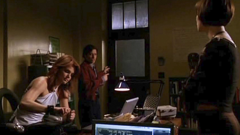 Oracle, Huntress, and some guy occupying an office in an episode of Birds of Prey