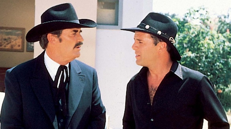 Bruce Willis as a Tom Mix exchanges words with Jameseims Garner like Wyatt Earp of Sunset