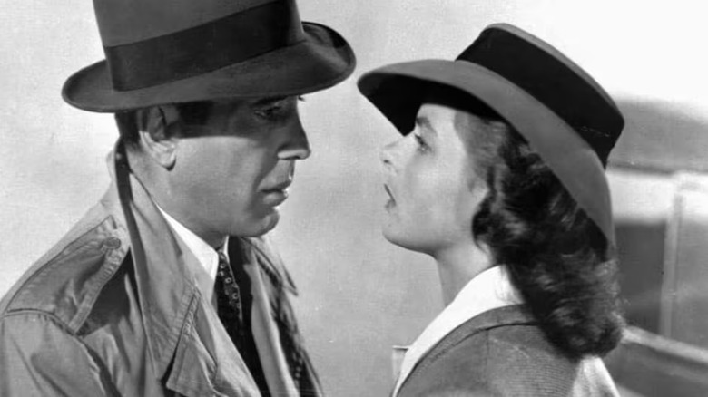 Rick and Ilsa wearing hats and looking at each other in Casablanca